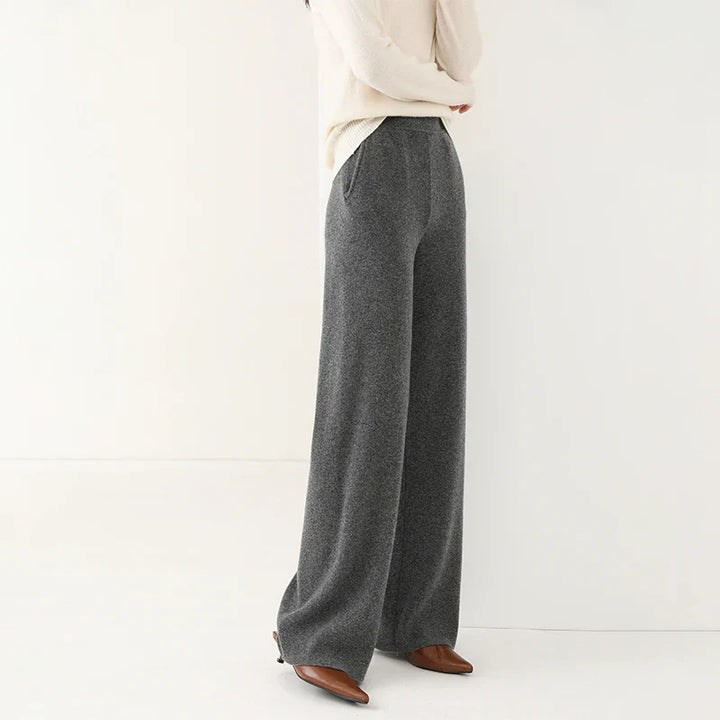 Model wearing comfortable women's merino wool wide-leg lounge pants, paired with a matching top