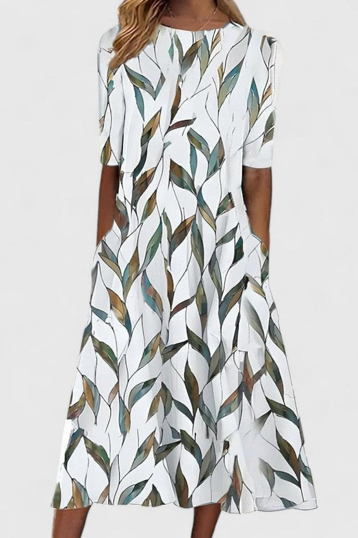 Floral print women's midi A-line dress featuring short sleeves, round neck, and pockets for versatile everyday style.