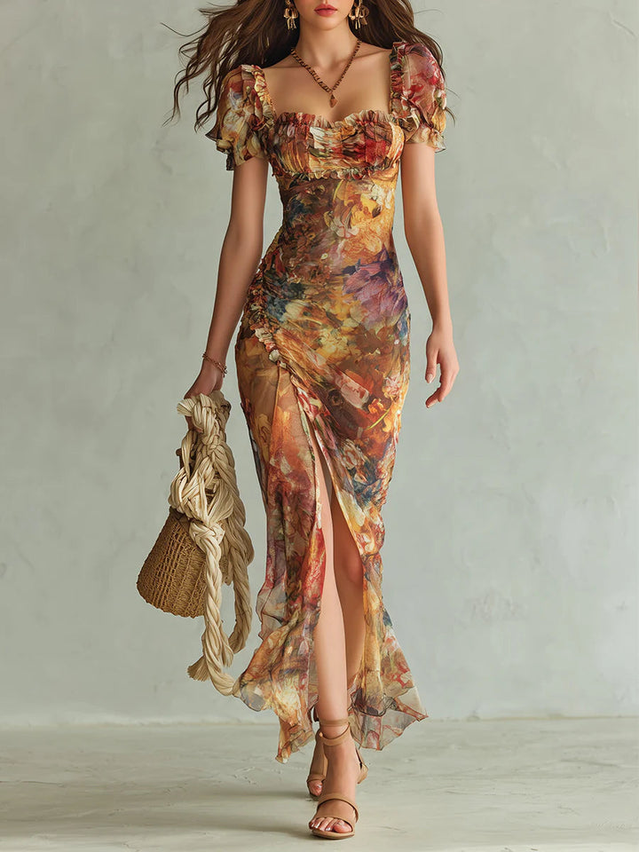 Women's orange floral print maxi dress with ruffle neckline, ruched bodice, and side slit for summer vacation.