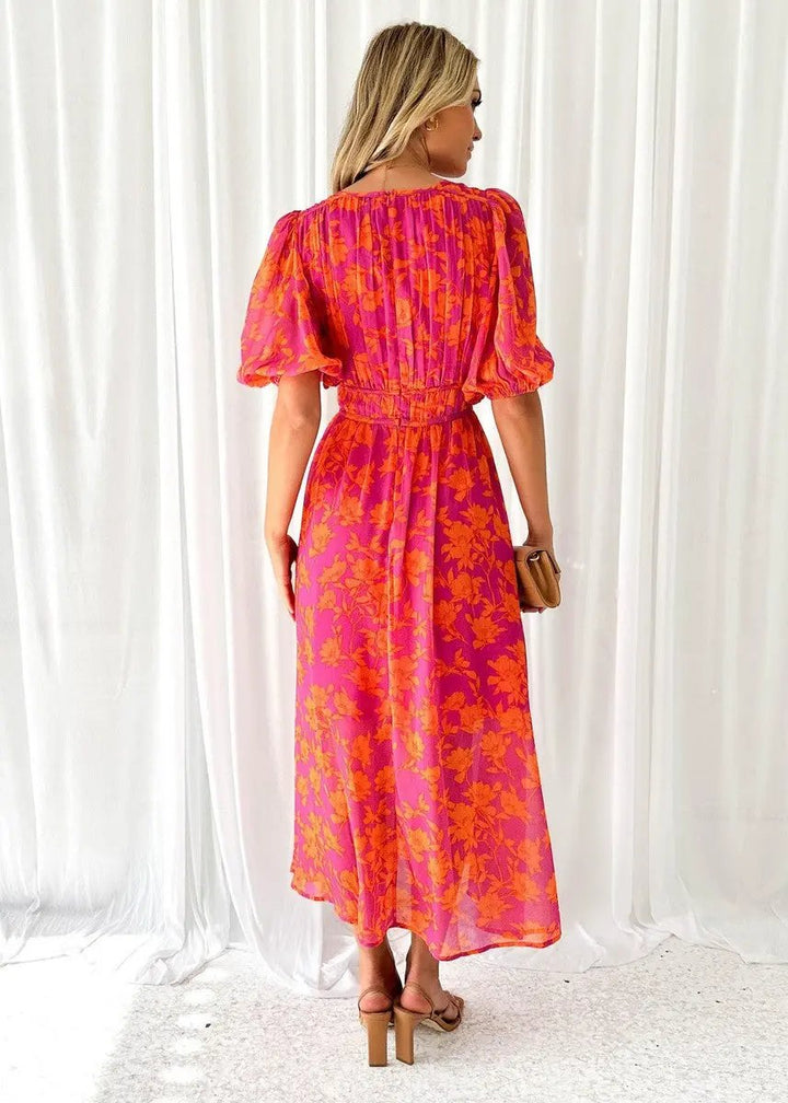 Casual women's orange V-neck puff sleeve midi dress, ideal for summer gatherings or elegant spring events.