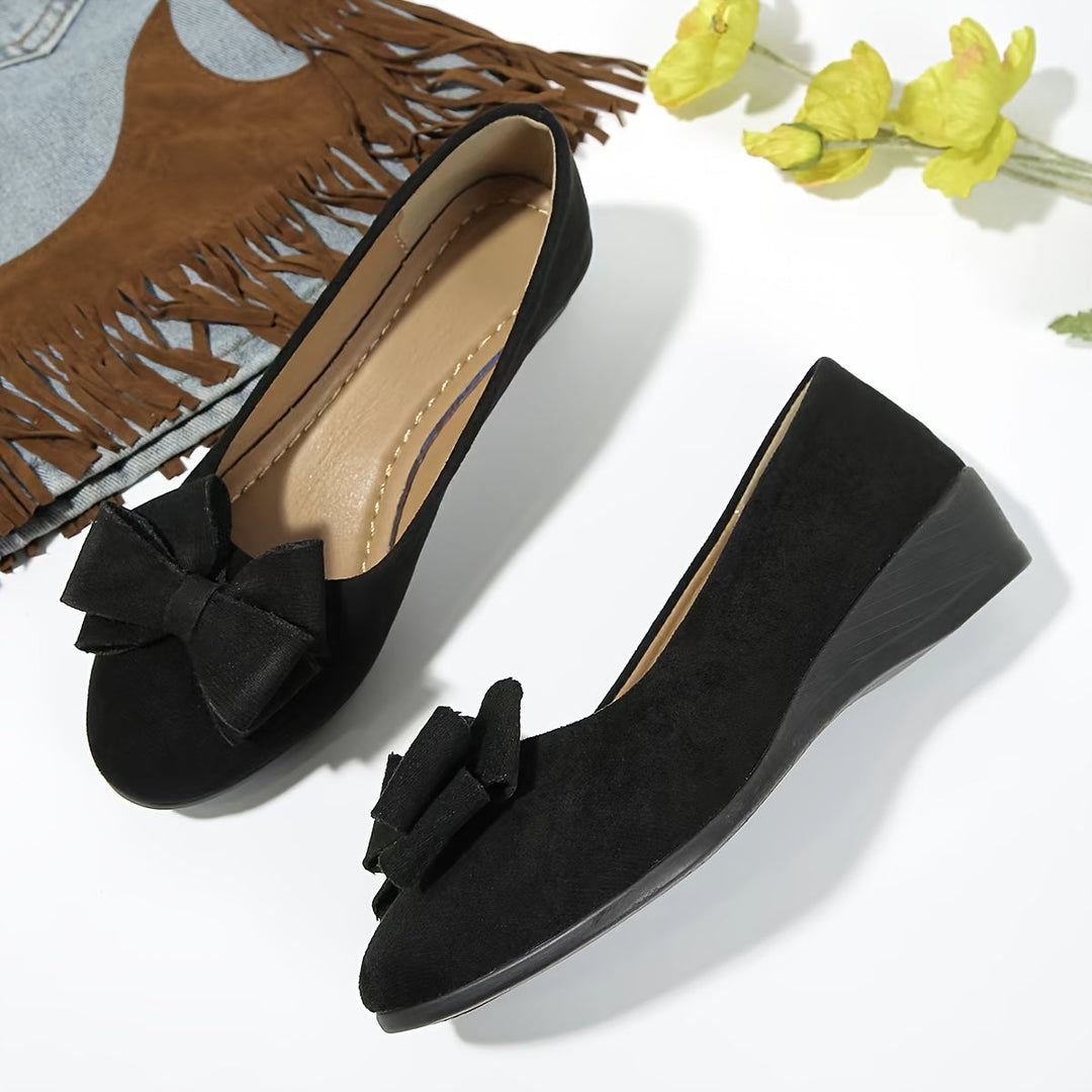 Side view of women's orthopedic flats, showing arch support & comfort design.