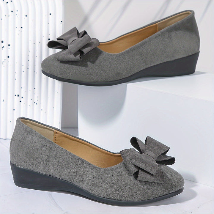 Women's comfort flats, orthopedic design for arch support & stylish appearance.
