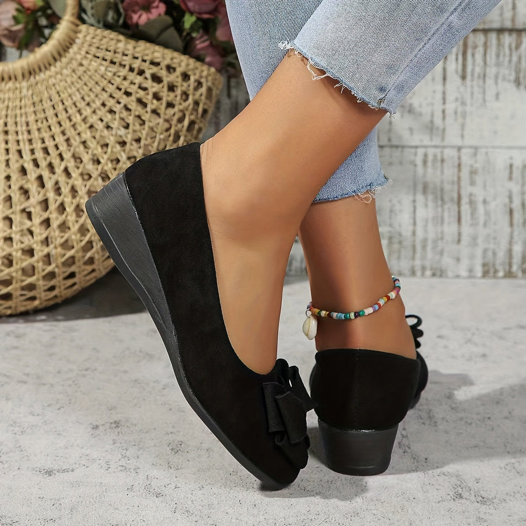 Women's orthopedic flats in classic black, providing ultimate comfort & support.