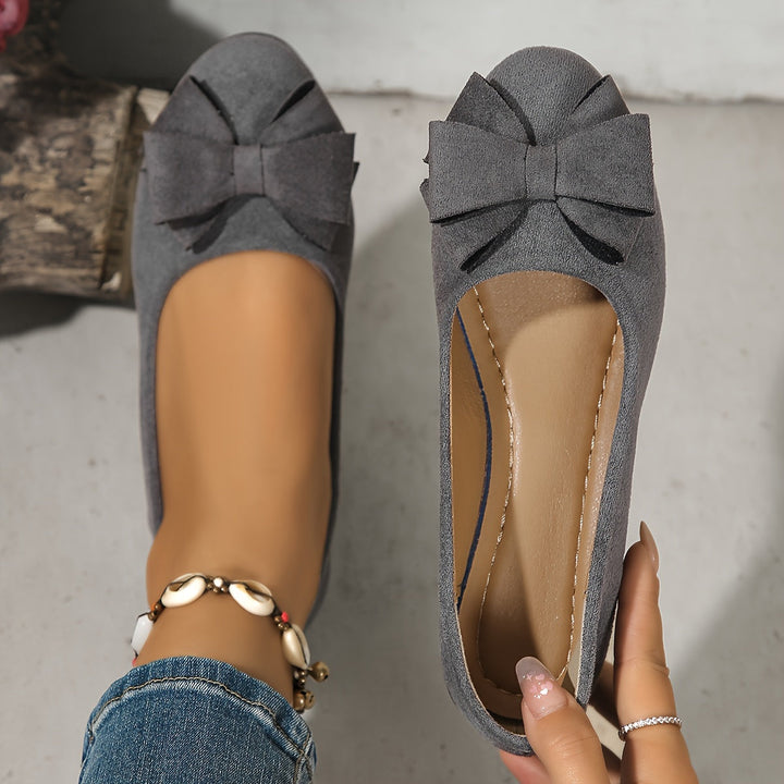 Women's orthopedic flats with bow detail, ensuring all-day comfort & foot health.