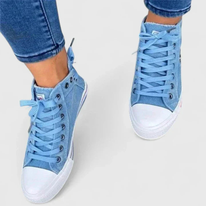 Pair of navy blue women's orthopedic walking shoes, featuring supportive design for ultimate comfort.