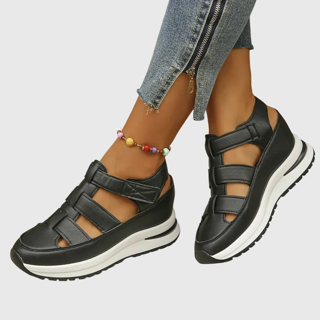 Women's orthopedic sandals with adjustable arch support for comfortable walking & summer style.
