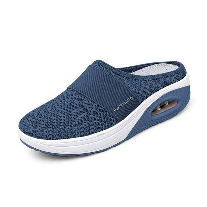 Women's supportive orthopedic slip-on walking shoes, ensuring arch support & comfort.