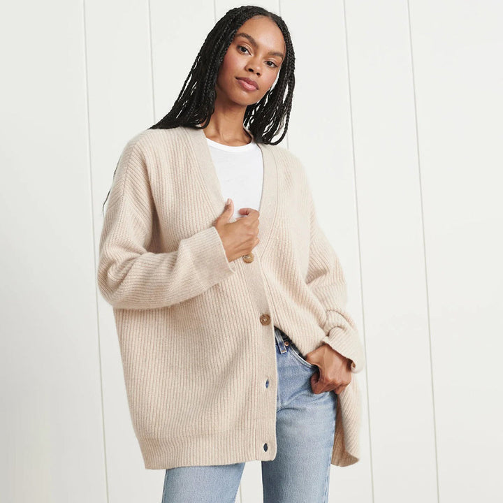Chic oversized button-up cardigan with V-neck, perfect for women's fall fashion layering.