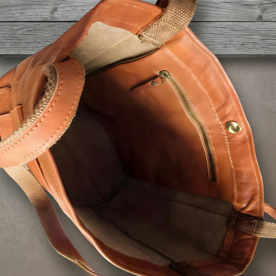 Durable women's oversized leather tote bag with large capacity & external pocket for daily use or travel.
