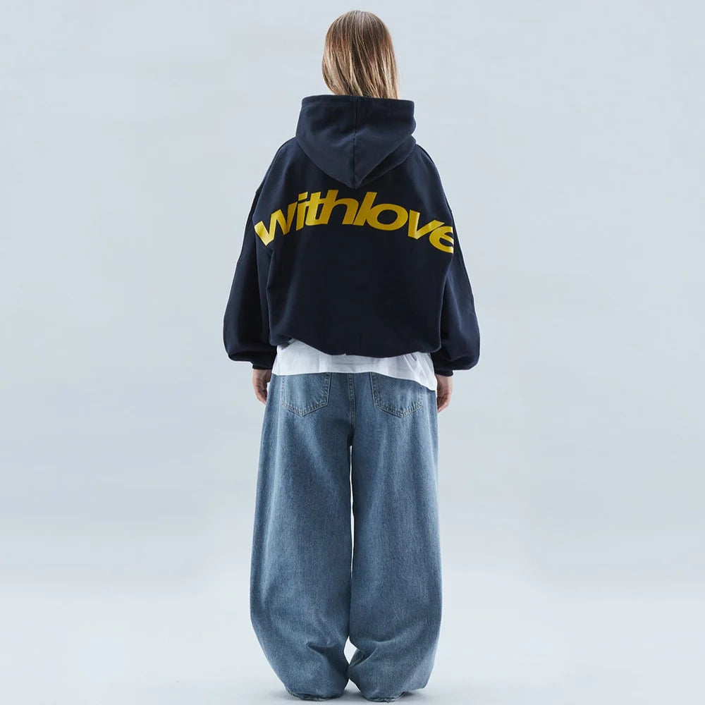 Stylish women's cropped hoodie with bold graphic, oversized fit, drop shoulders, and long sleeves.