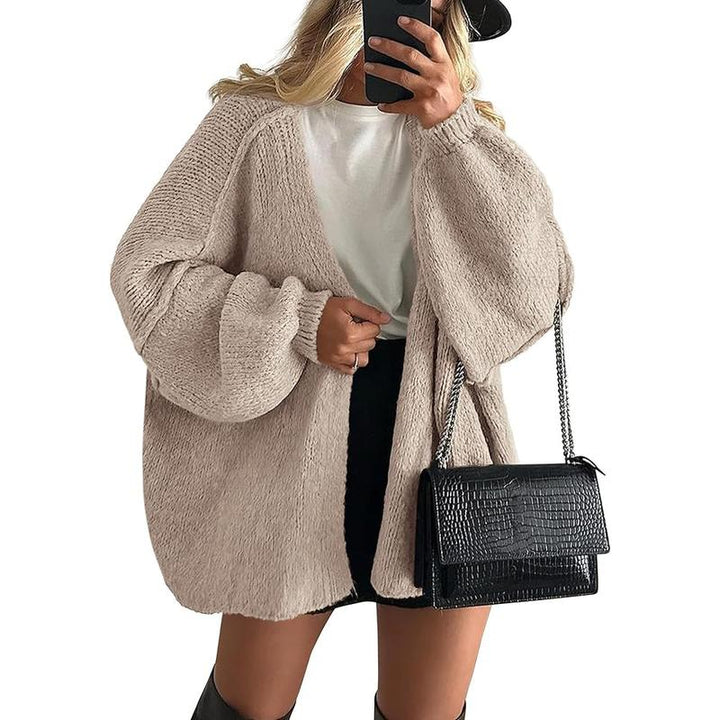 Cozy women's oversized knit cardigan, an essential piece of acrylic blend winter wear and fashion.
