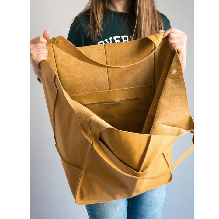 Sophisticated women's oversized vintage leather cross body bag, a stylish travel companion.