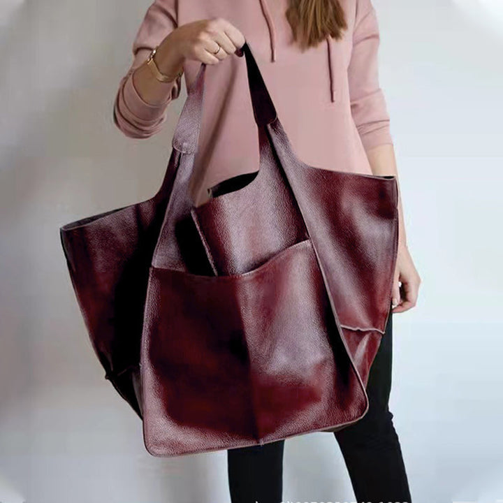 Durable women's oversized vintage leather tote, a stylish and practical shoulder bag.