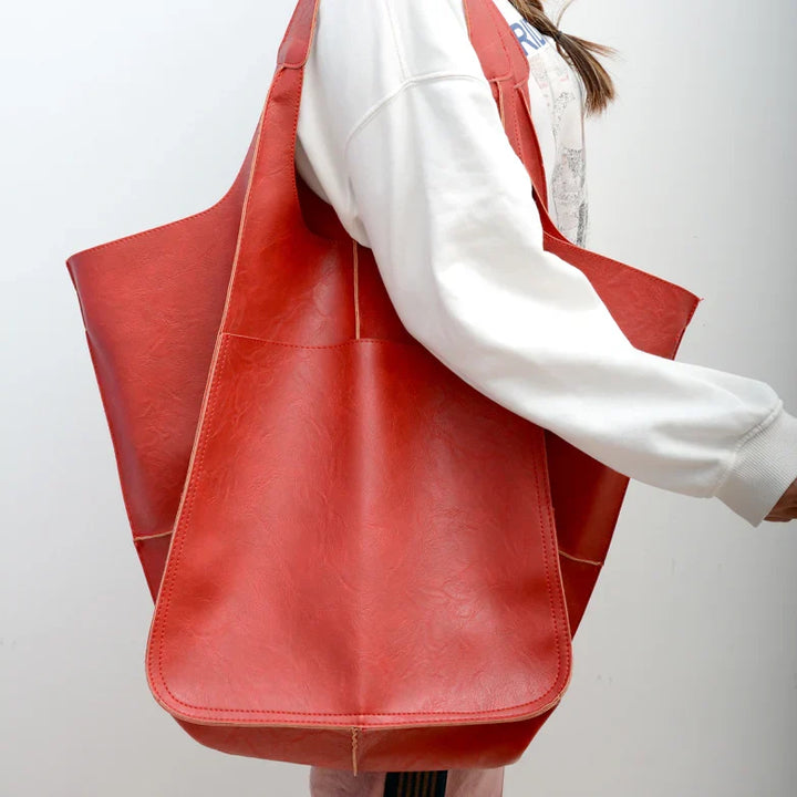 Vintage leather oversized shoulder bag for women, a large capacity daily tote handbag.