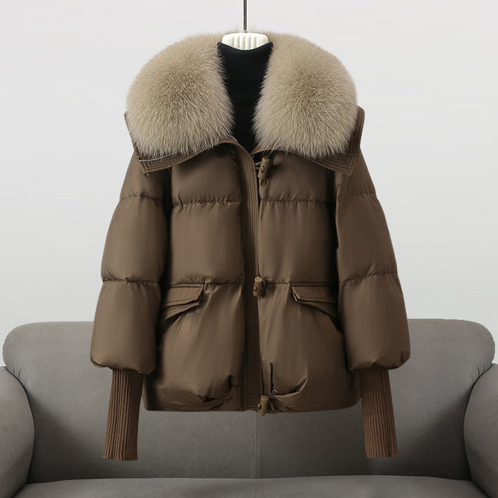 Casual women's outerwear: a warm, padded coat featuring an elegant fur collar