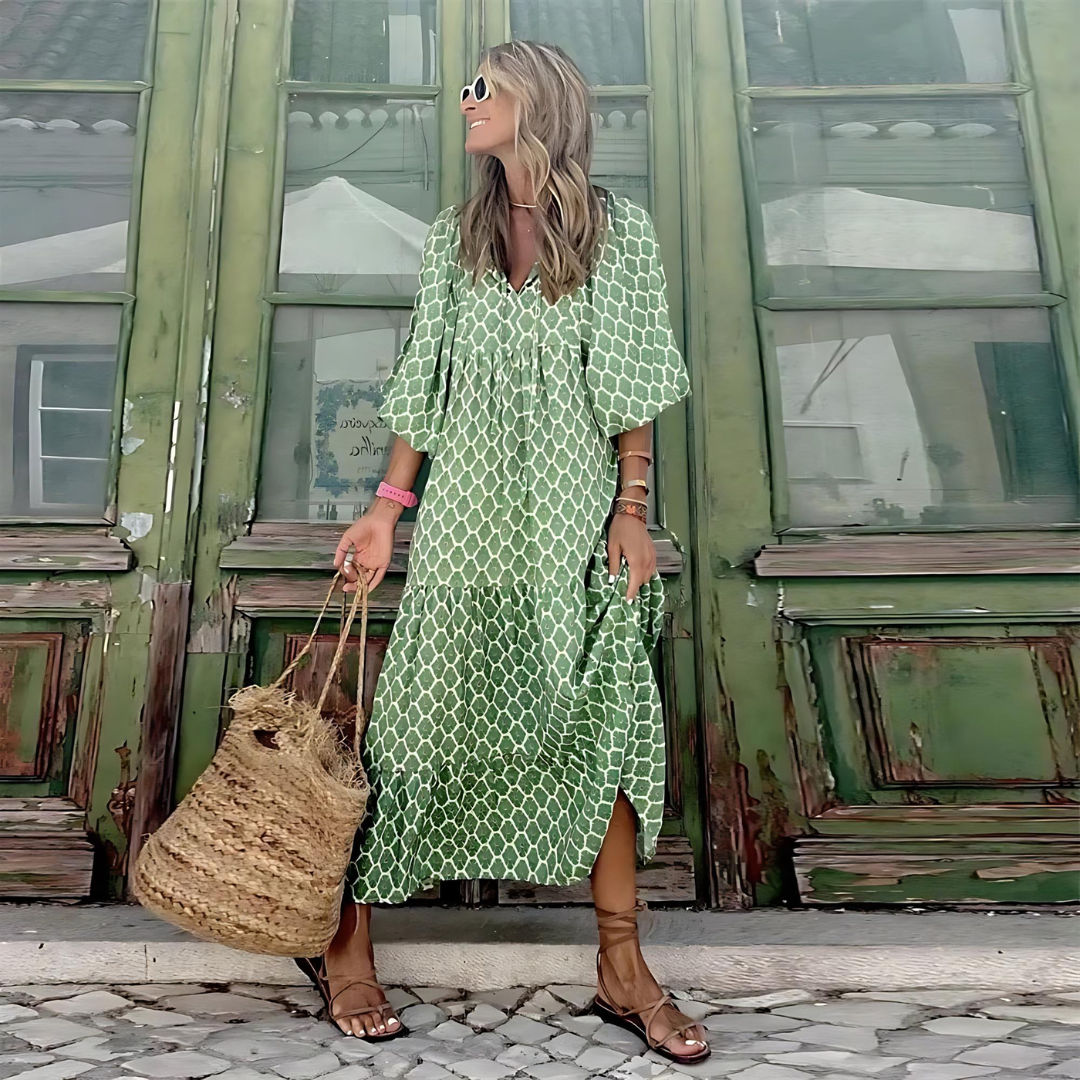 Vibrant patterned long sleeve maxi dress for women. Elegant V-neck, flowy silhouette, perfect for spring outfits.