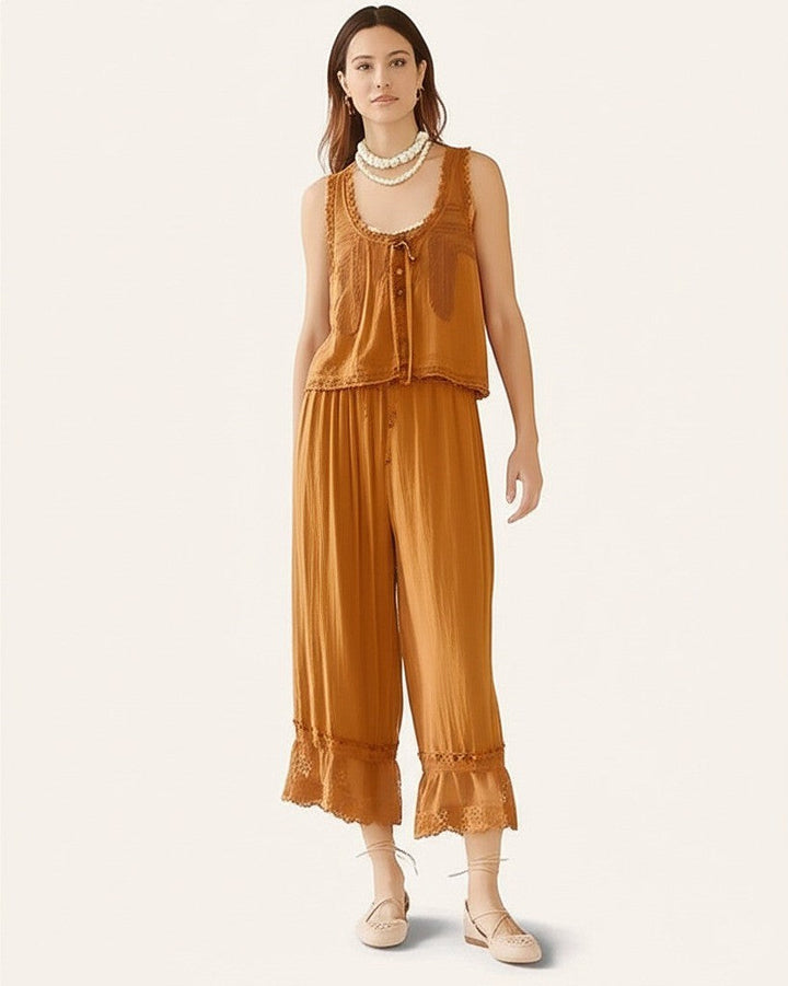 White women's two-piece cotton set, lace-trimmed, offering a fresh and airy summer outfit.