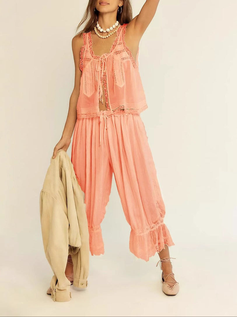 White cotton two-piece set, women's, with beautiful lace trim, styled for a casual summer look.