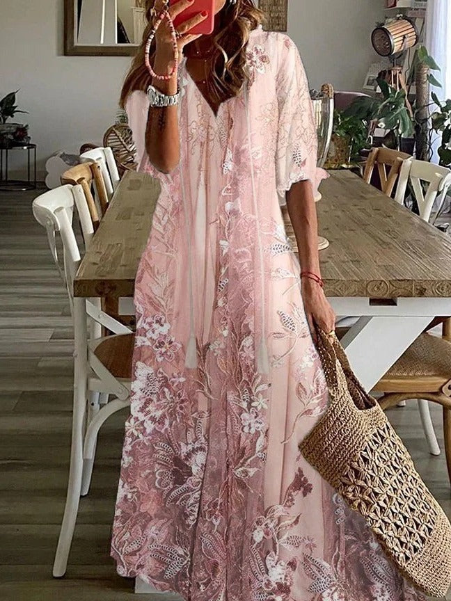 Elegant women's flowing floral print maxi dress with V-neck & half sleeves for spring/summer fashion.