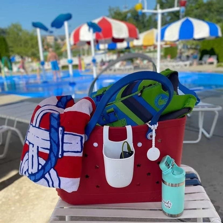 Stylish women's EVA tote, sandproof, washable, and vented, ideal for beach essentials.