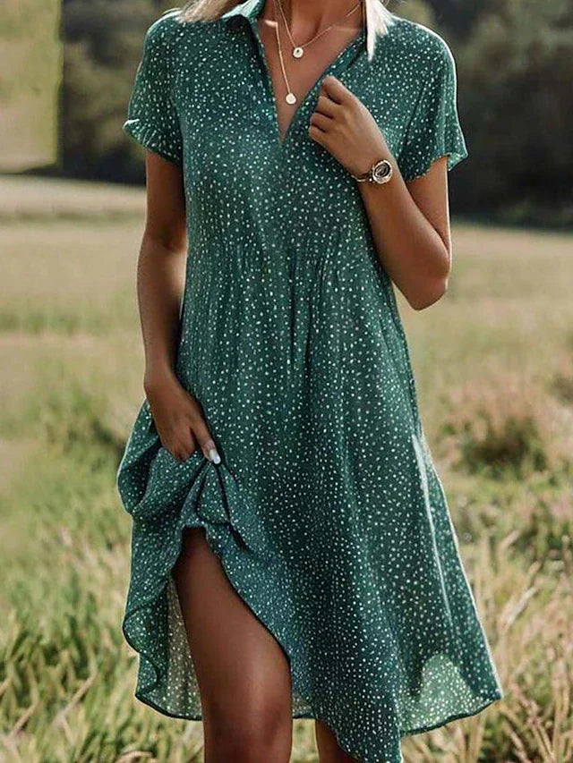 Women's playful polka dot A-line summer dress with V-neck, short sleeves. Breezy & comfortable knee-length day dress.