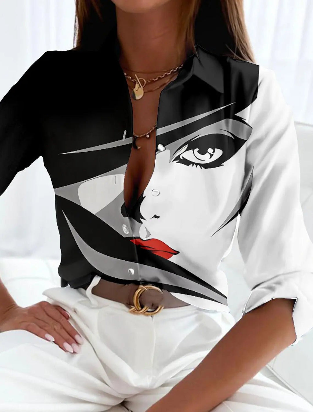 Plus size women's button-up top with eye-catching abstract geometric pattern. Comfortable long sleeve design for modern fashion.
