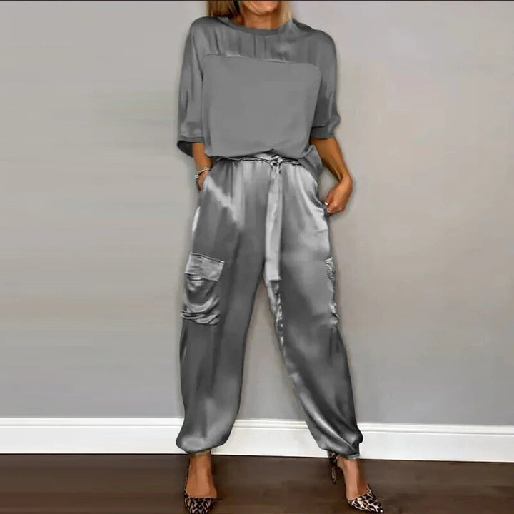 Stylish plus size cargo pants set for women. Features drawstring waist and utility pockets for a chic, casual look.