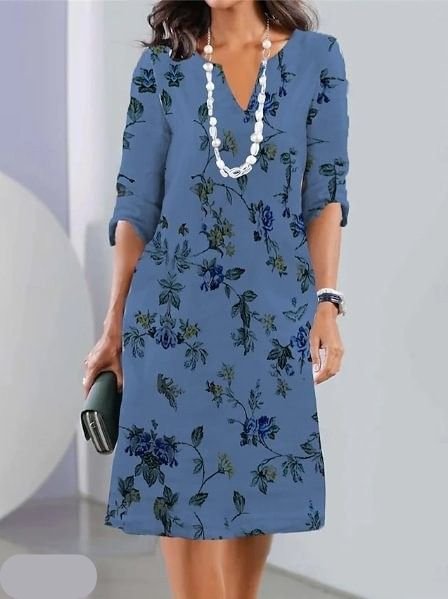 Stylish plus size floral midi dress featuring a chic V-neck and flowy A-line design, perfect for any event.