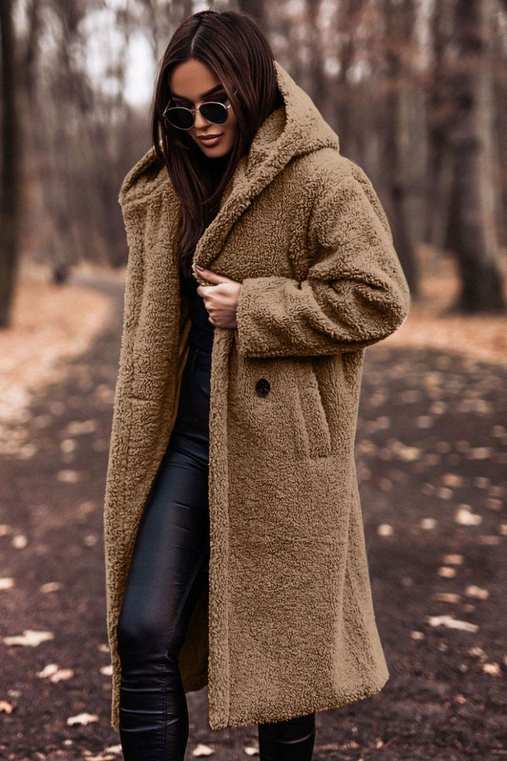 Close-up of the hood and collar on a women's plush faux shearling long coat