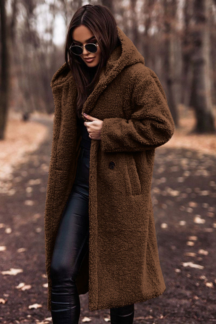 Long winter coat for women, featuring plush faux shearling and a hood