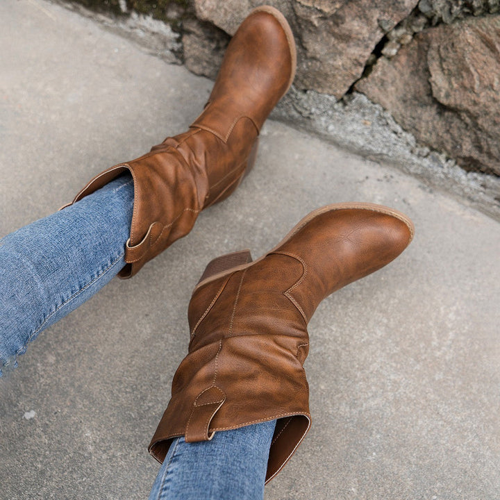 Chic women's cowboy boots in a unique burgundy leather, mid-calf length, perfect for fall.
