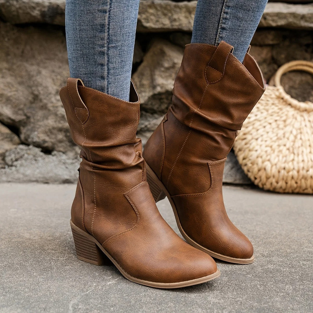 Front view of women's pointed-toe mid-calf boots in a classic dark brown, Western-inspired.