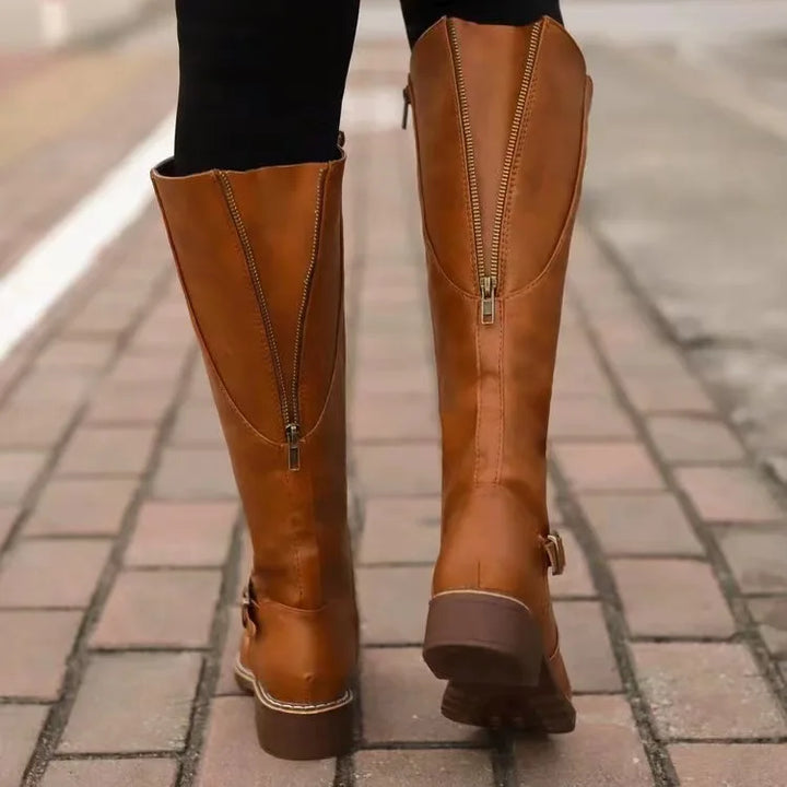 Women's fashion orthopedic ankle boots, made from high-quality leather, side profile on white background