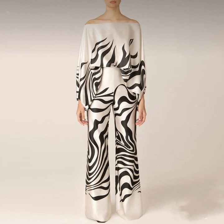 Flowy one-shoulder top & wide-leg pants co-ord set for women. Printed two-piece outfit, perfect for statement looks.