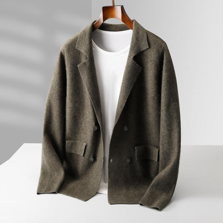Woman's hand touching the soft knitwear of the cashmere button-front cardigan sweater, comfort focus