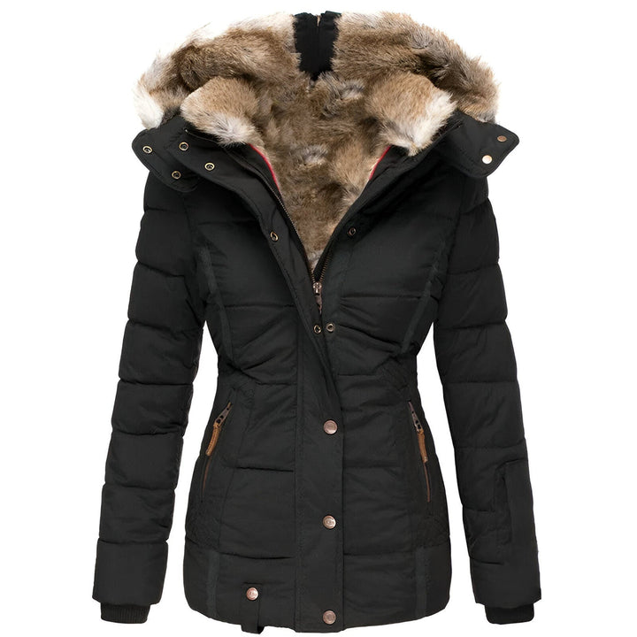 Women's quilted puffer jacket with a luxurious faux fur hood, perfect for stylish winter warmth.