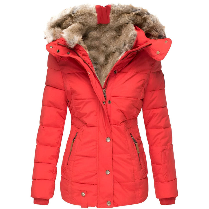 Close-up of a women's puffer jacket showcasing its elegant quilting and soft faux fur hood.