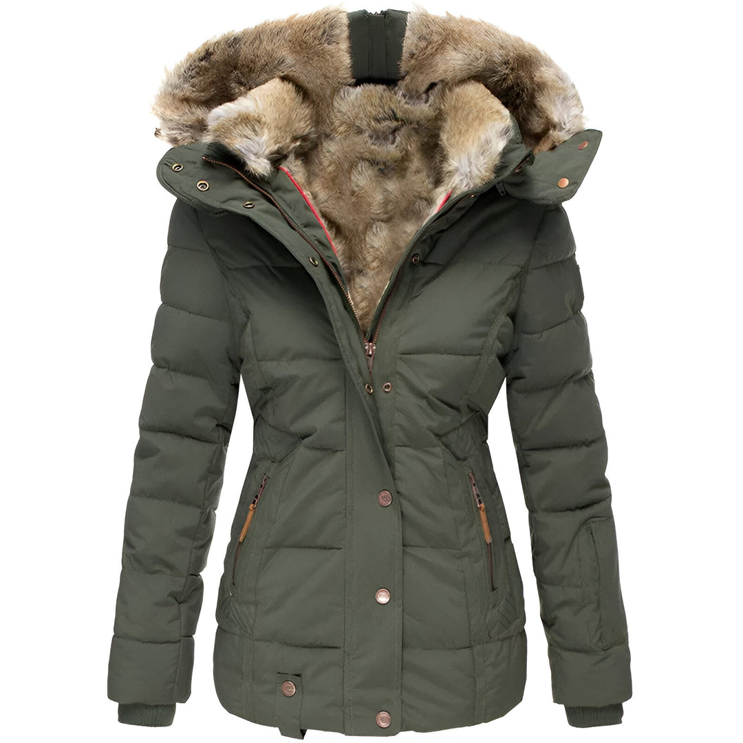 Full-length view of a woman wearing a warm, quiled puffer jacket with a chic faux fur-trimmed hood.