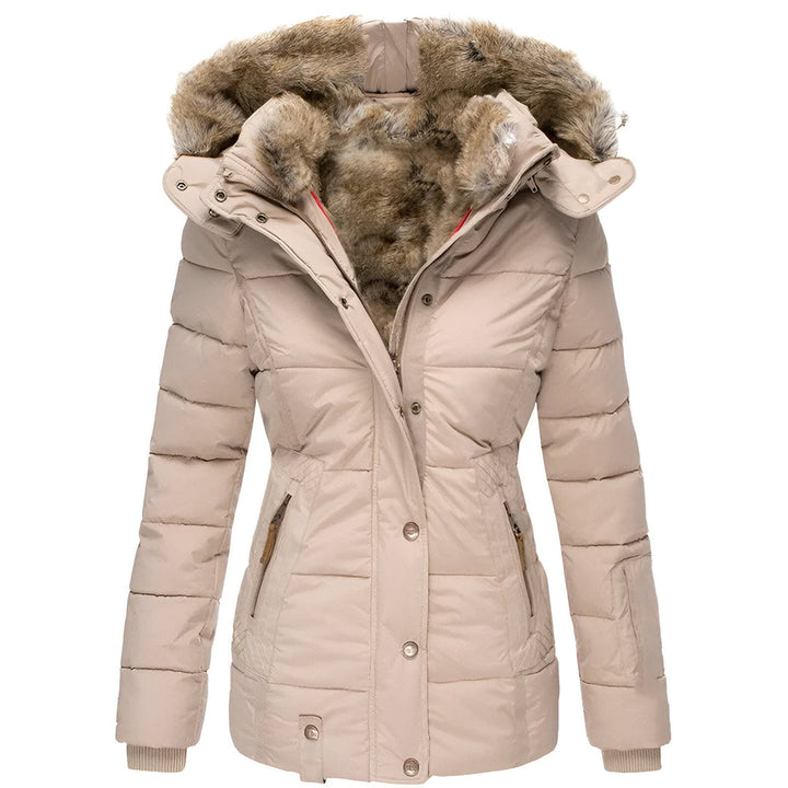 Side profile of a women's puffer jacket, highlighting its feminine fit and cozy faux fur hood.