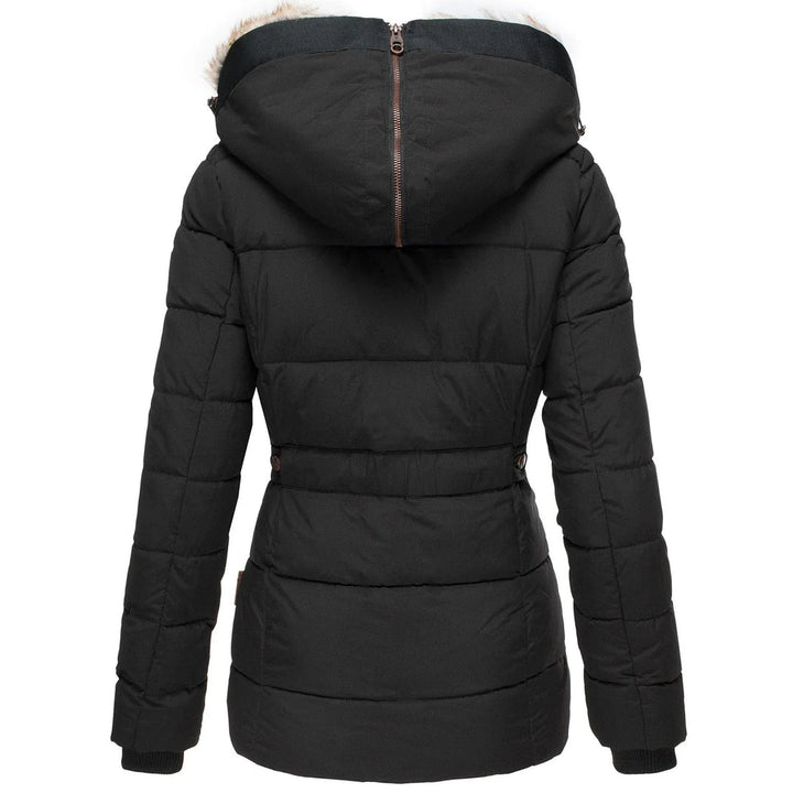 Stylish women's quilted outerwear: a puffer jacket with a fashionable faux fur hood for ultimate warmth.