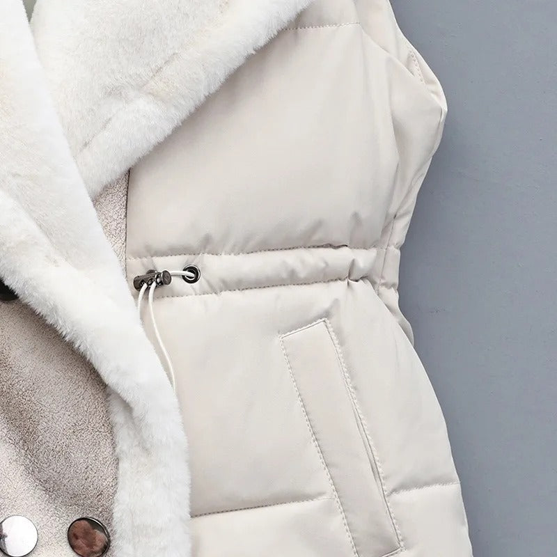 Detailed shot of the faux fur trim on a women's fashionable puffer vest, soft and cozy