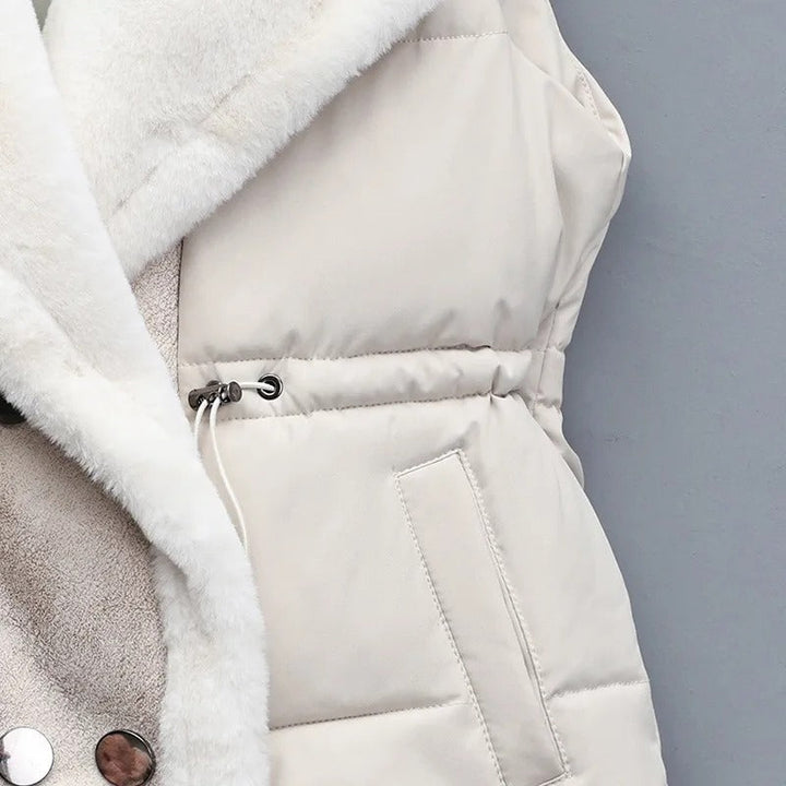 Detailed shot of the faux fur trim on a women's fashionable puffer vest, soft and cozy