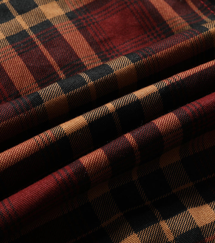 Plaid flannel jacket for women, laying flat, highlighting soft texture and casual style.