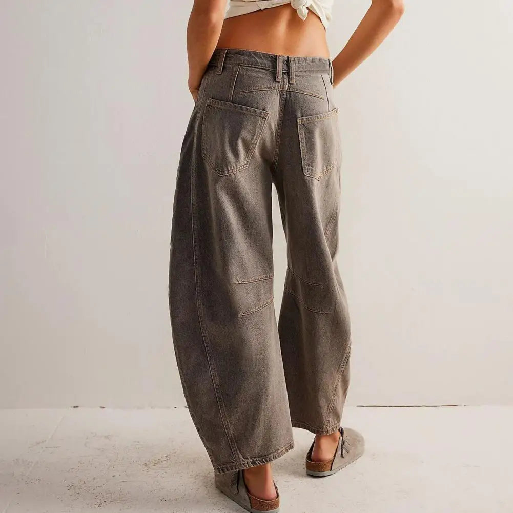 Studio shot of women's barrel leg denim jeans, highlighting the unique cut and comfortable design