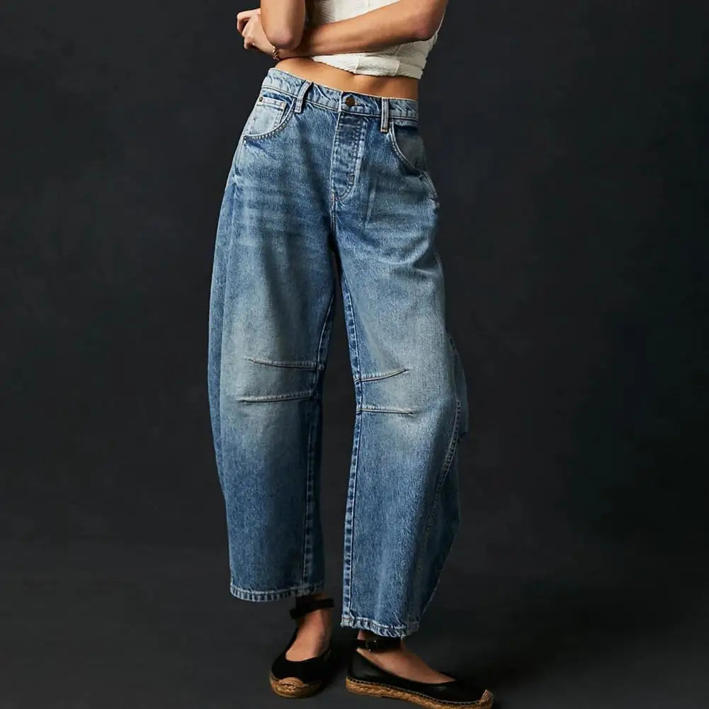 Model wearing women's barrel leg denim jeans, mid-rise, perfect for casual and comfortable style