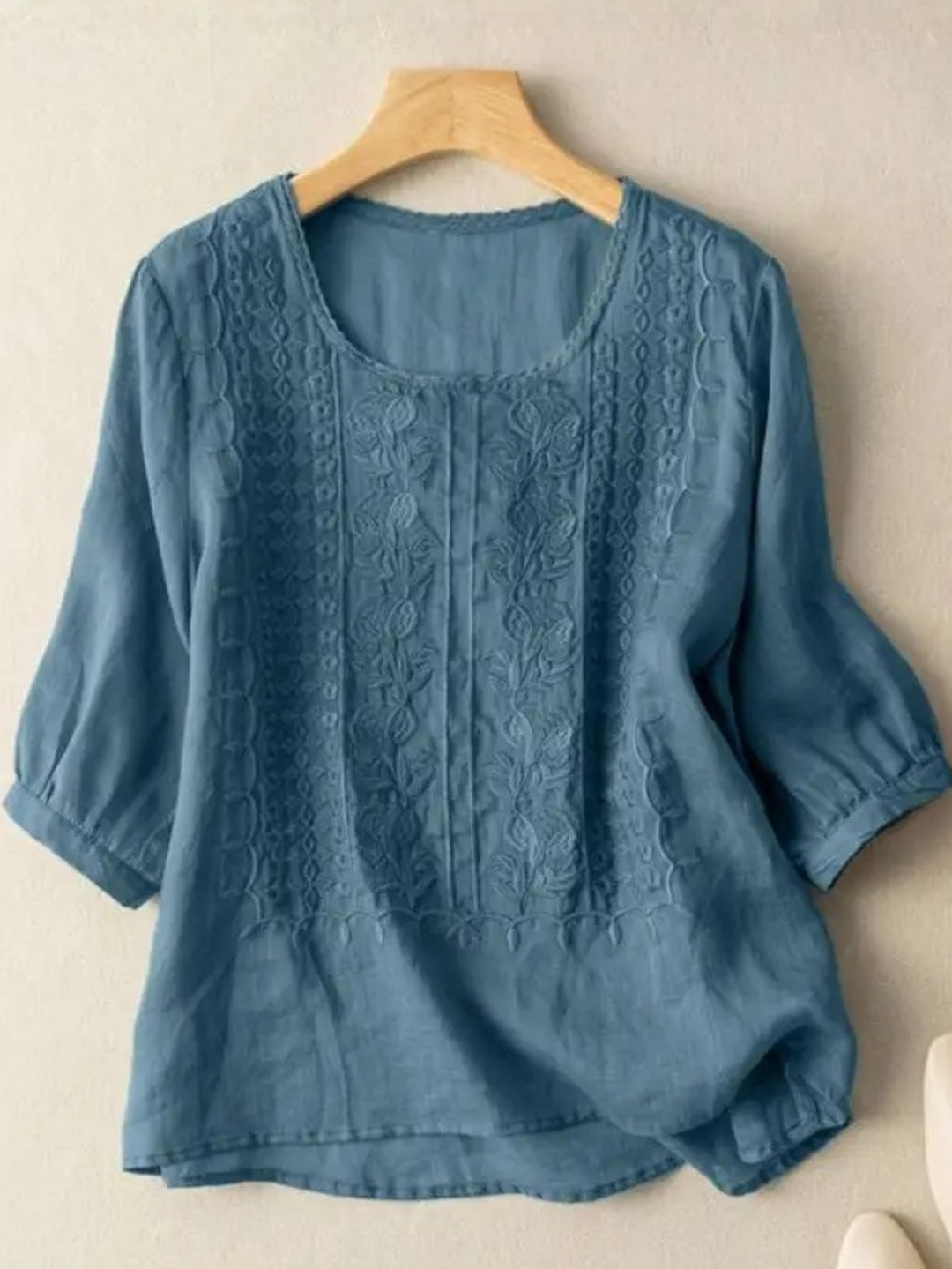 Versatile women's embroidered blouse, relaxed fit, perfect for spring fashion or elegant summer casual wear.