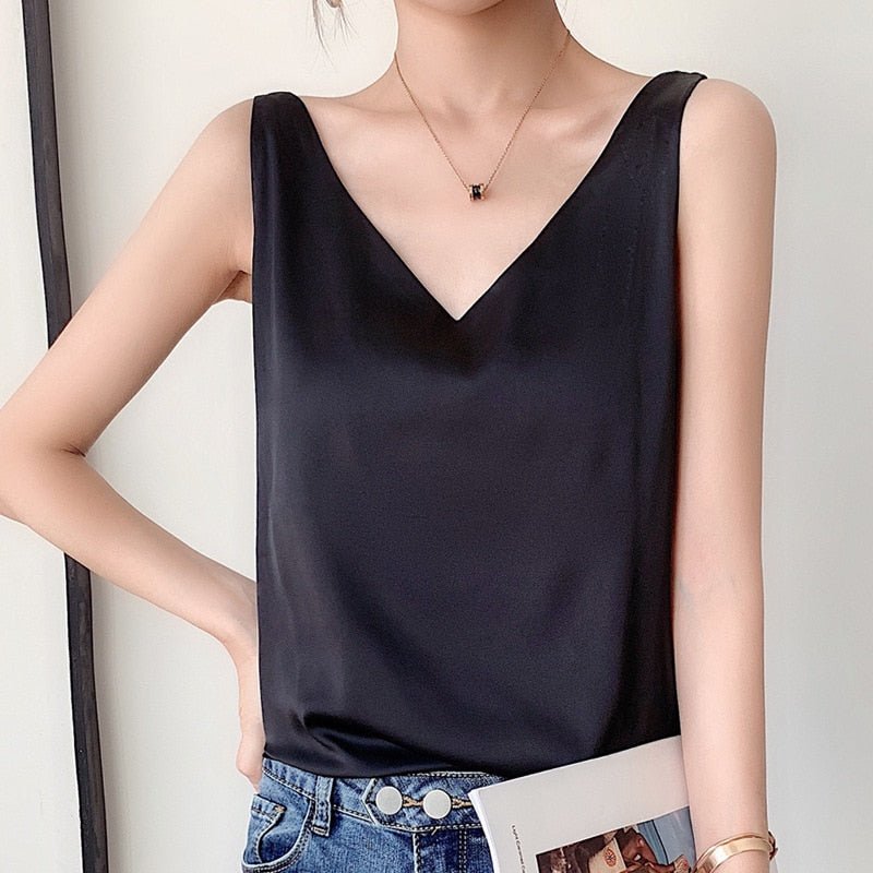 Women's relaxed fit draped satin V-neck tank top in soft pink, elegant and versatile for summer.