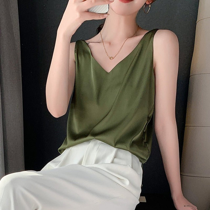Chic women's satin V-neck tank top with a relaxed drape, ideal for warm weather comfort and style.