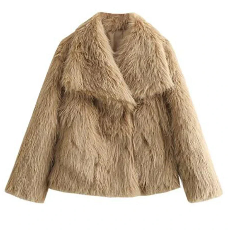 Stylish women's relaxed fit faux fur jacket draped over a chair, ready for cozy winter fashion.