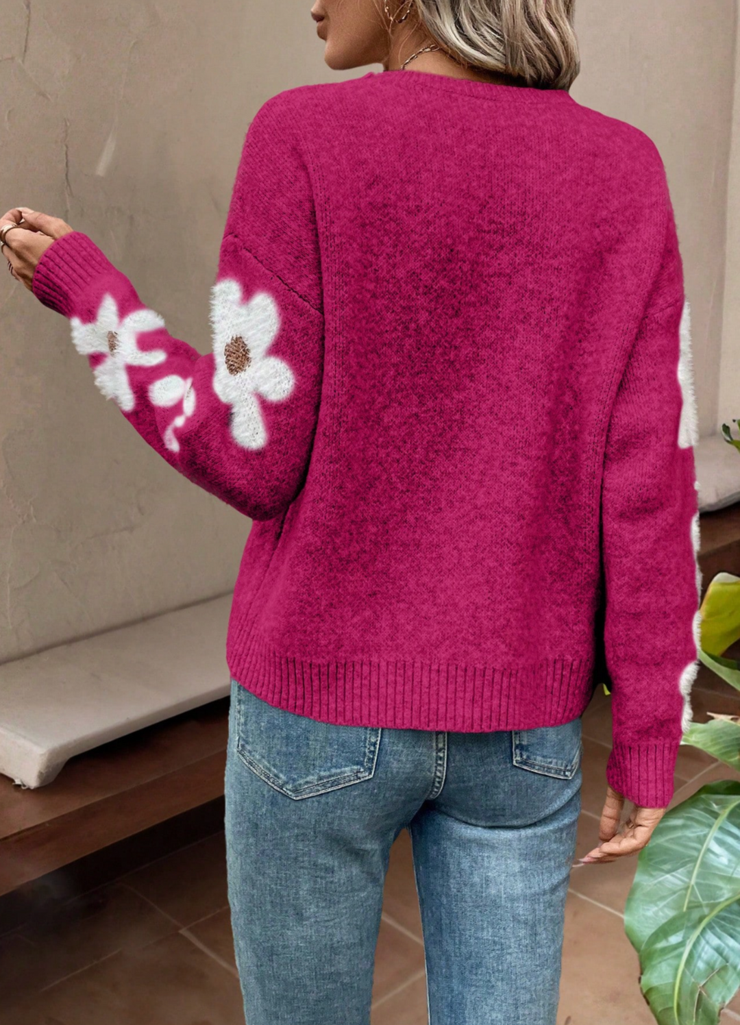 Soft women's pullover sweater featuring a lovely daisy design, a must-have for winter wear.